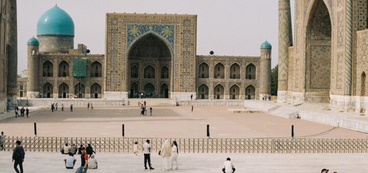 a group of people standing in front of a building